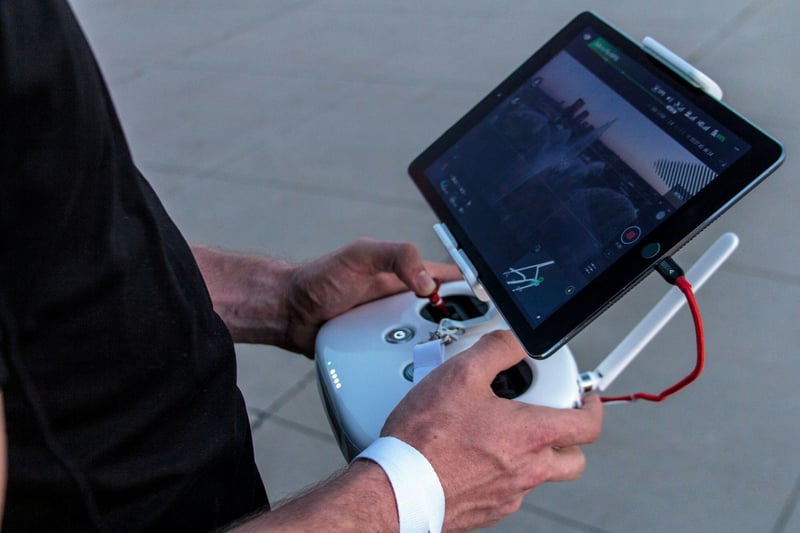 Person controlling a drone with a remote control